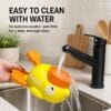 cat-dog-toys-31-2 washable duck puzzle feeder cleaning scene running tap water flushing whole plastic duck pet toy inside kitchen sink