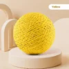 cat-toy-ball-40-4 bright yellow woven sisal cat toy ball full product shot on neutral beige display platform