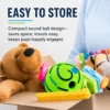 dog-rolling-squeaky-ball-toy-37-6 treat free puppy squeaky play ball packaged storage display shot green rubber dog toy placed inside pet toy storage box mixed with other plush and plastic dog toys