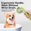 pet-bath-brush-34-1 pet bath brush press dispense silicone massager dog bathing scene with corgi puppy in tub hand holding green long handle pet shower groomer ergonomic grip design demonstration