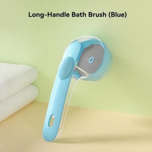 pet-bath-brush-34-3 long handle pet bath brush blue full overall product shot resting on pale yellow surface folded white towel on left clear body with silicone massage bristles head